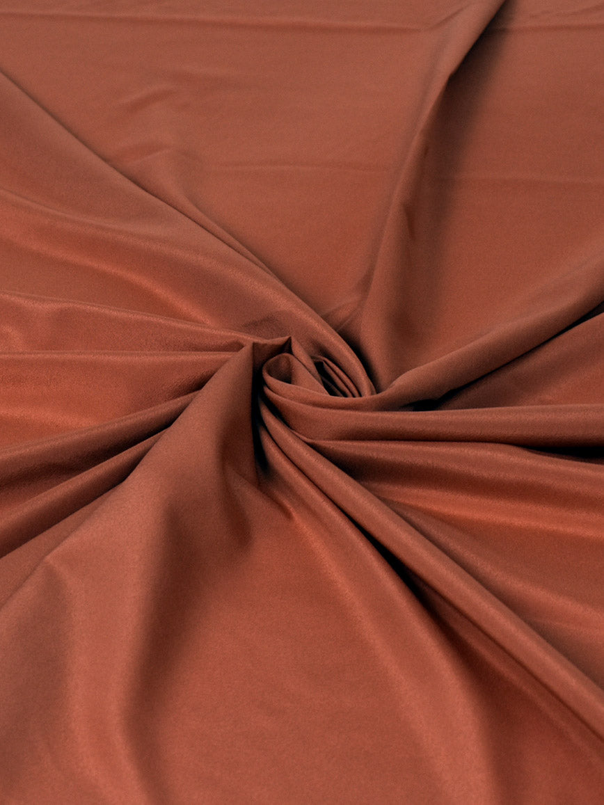 Salmon pink polyester crepe